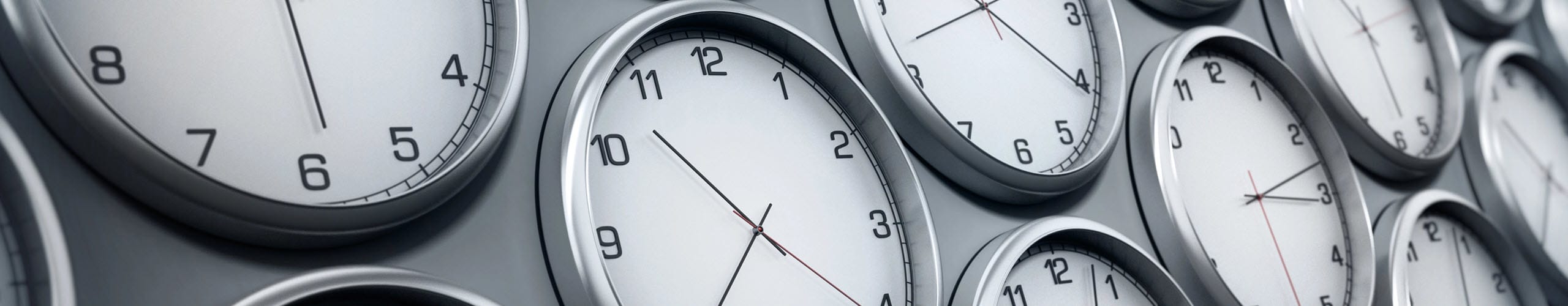 Different clocks showing multiple time zones around the world